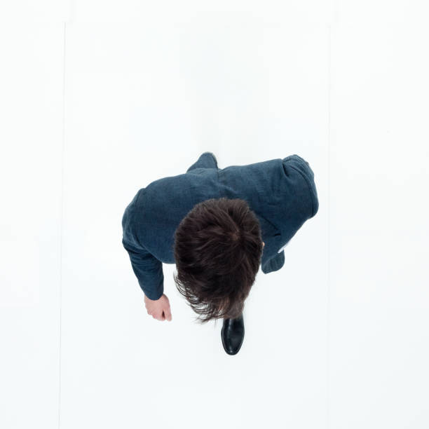istock Directly above view of businessman walking 949568920