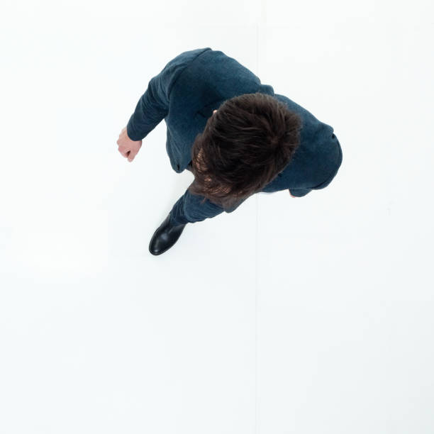 istock Directly above view of businessman walking 949568924