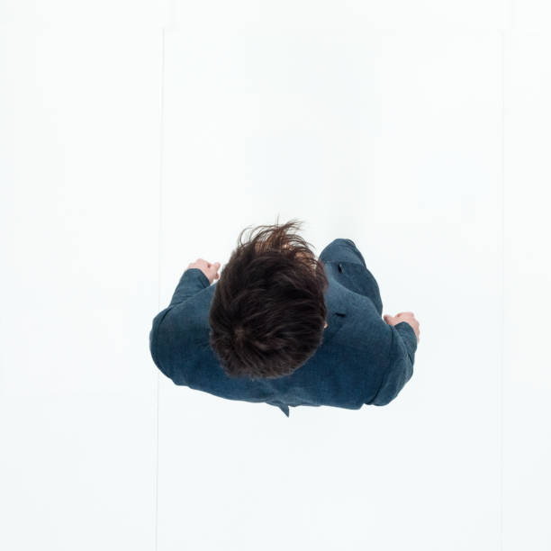 istock Directly above view of businessman walking 949569026