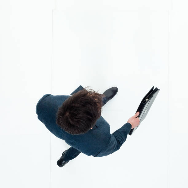istock Directly above view of businessman walking 949569254