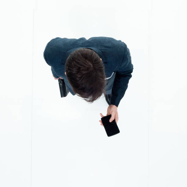 istock Directly above view of businessman using smart phone 949569298
