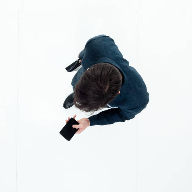 istock Directly above view of businessman using smart phone 949569330
