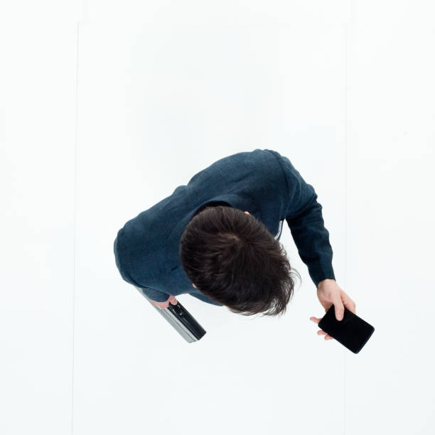 istock Directly above view of businessman using smart phone 949569368