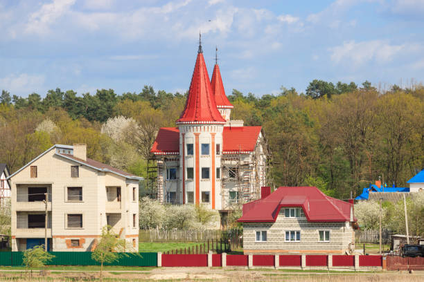 istock Village houses on forest background on a sunny day 949572490