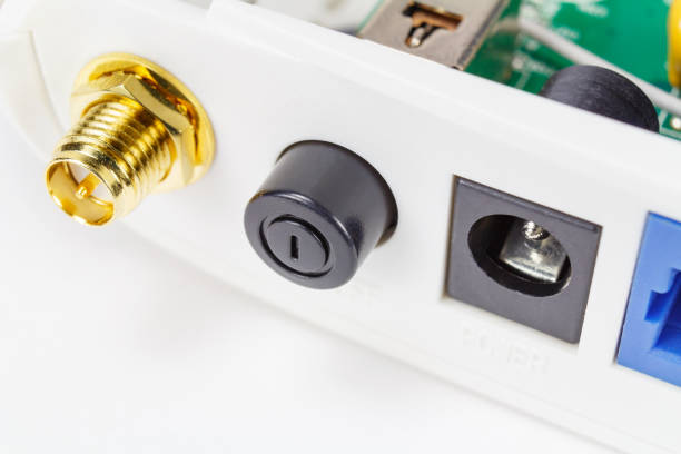 istock Power button with antenna and power connectors on the back panel of the router closeup 949573676