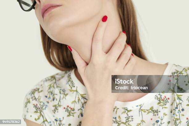 Young Woman Holding Her Throat Sore Throat Stock Photo - Download Image Now - Hypothyroidism, Thyroid Gland, Adult