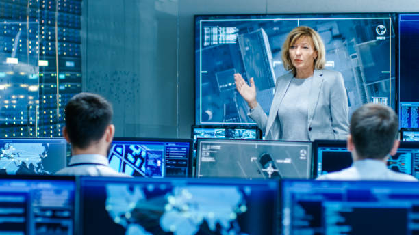 istock In the Government Surveillance Facility Team of Officers Organize Interception Plan with Help of Satellite Navigation. Big Screen Shows Top Down Images of the Target. 949581052