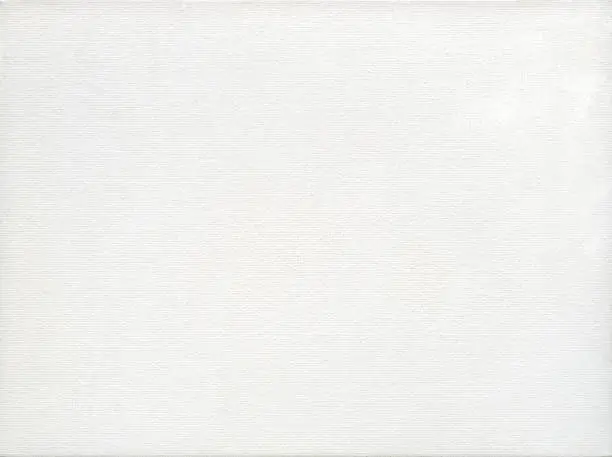 Photo of White canvas with delicate grid, for backgrounds or textures