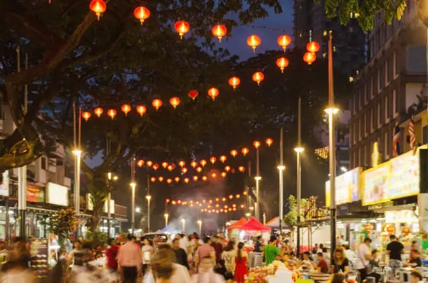 Photo of Jalan Alor in nighttime- Food Street in Kuala Lumpur City Center. Blurred photo.