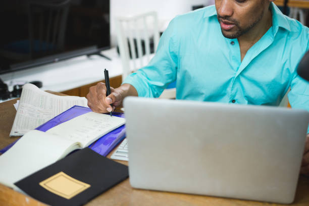 istock African American man working at home using laptop 949603786
