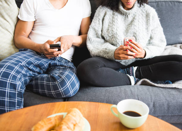 istock Couple using smart phones in the morning 949608504