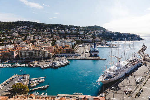 NICE, FRANCE - 17 SEPTEMBER 2017: harbour of old european city located on seashore on sunny summer day