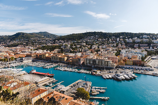 NICE, FRANCE - 17 SEPTEMBER 2017: aerial view of harbour of old european city located on seashore