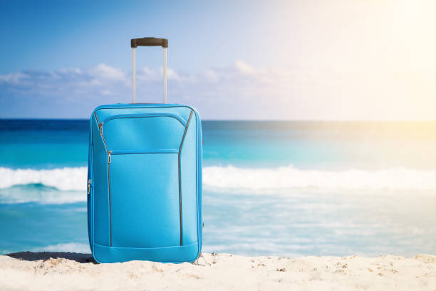 istock Travel trolley on tropical seaside 949611698