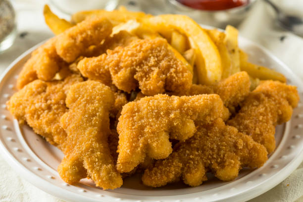 istock Kids Dinosaur Shaped Chicken Nuggets 949611722