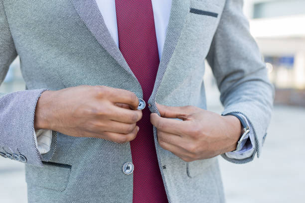 istock Closeup of a business man buttoning his suit 949614558