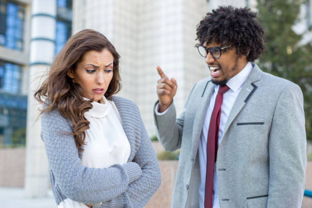 istock Angry boss yelling at business woman at work 949615510