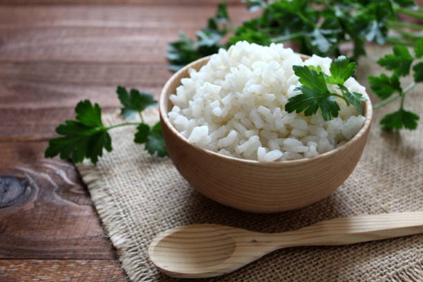istock White rice in wooden bowl. 949615672