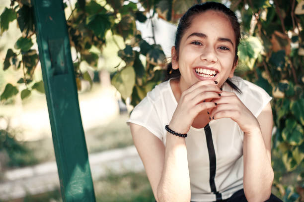 Close up portrait of a beautiful young girl at park