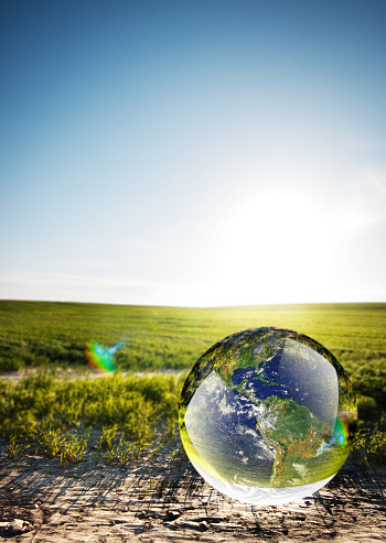 Crystal ball reflecting globe of the earth in nature\nhttps://upload.wikimedia.org/wikipedia/commons/d/db/Nasa_blue_marble.jpg