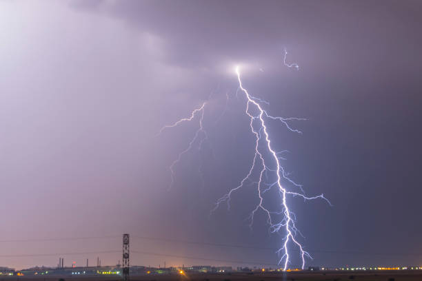 istock Lightning flash over a city, Thunderstorm , electricity blast storm 949623004