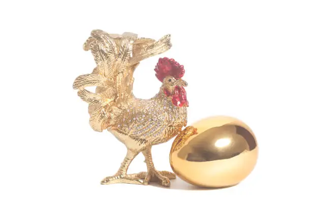 Photo of Golden rooster with golden egg