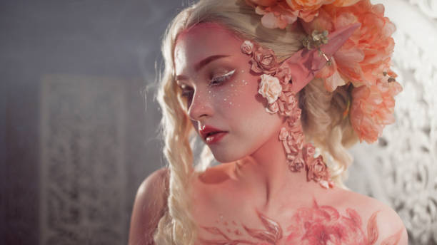 istock Young beautiful girl elf. Creative make-up and bodyart 949627414