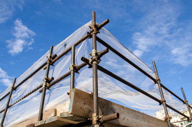 renovation of a roof of a building stock photo