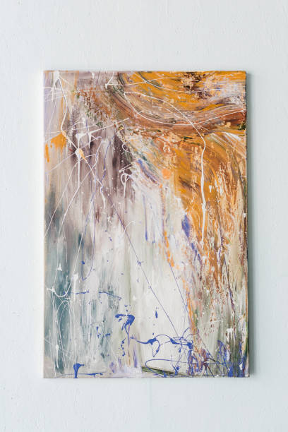istock Abstract painting in bright color spots hanging on a wall 949636042