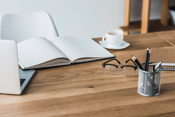 istock Work table with laptop and stationery in office 949640936