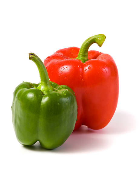 istock red and green bell peppers isolated 94968780
