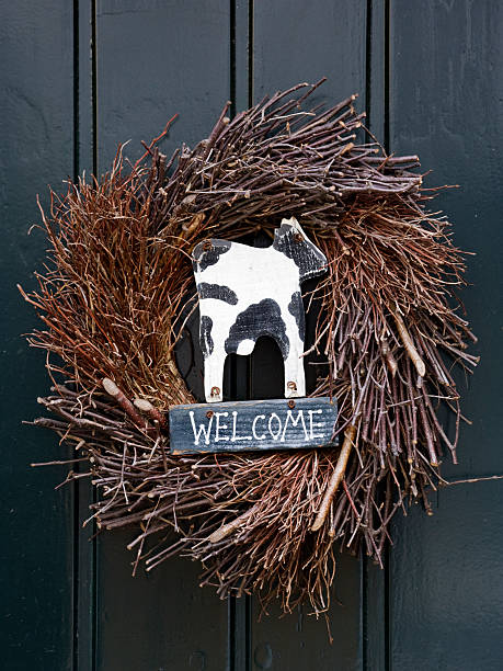 istock welcome sign with cow in wreath 94968855