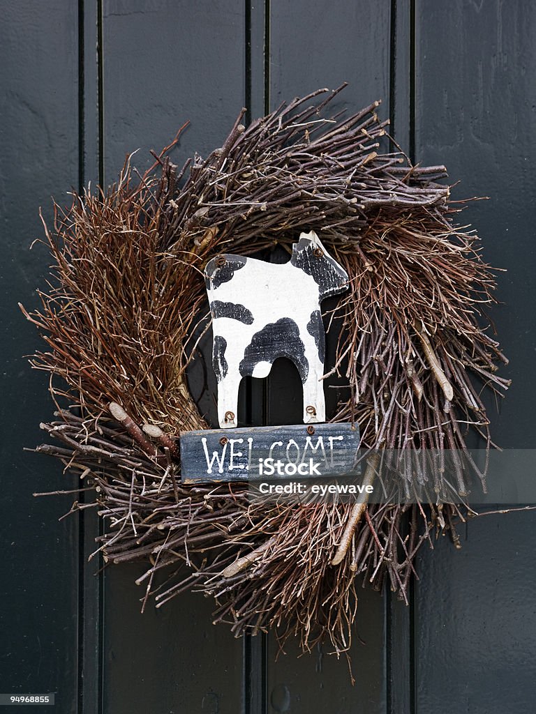 welcome sign with cow in wreath  Front Door Stock Photo