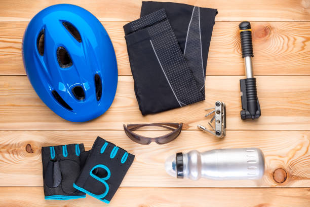 istock Protective accessories for cycling and tools on the wooden floor 949691856