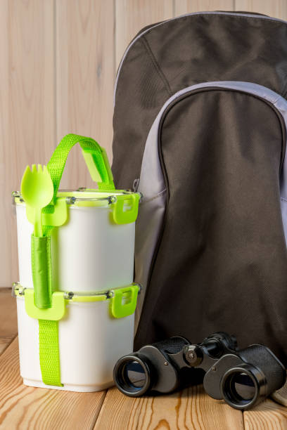 istock objects for a picnic in nature - backpack, binoculars and food containers 949691872
