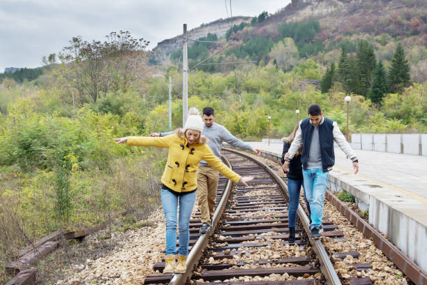 istock In-love young people have fun. Waiting for a train. 949691906