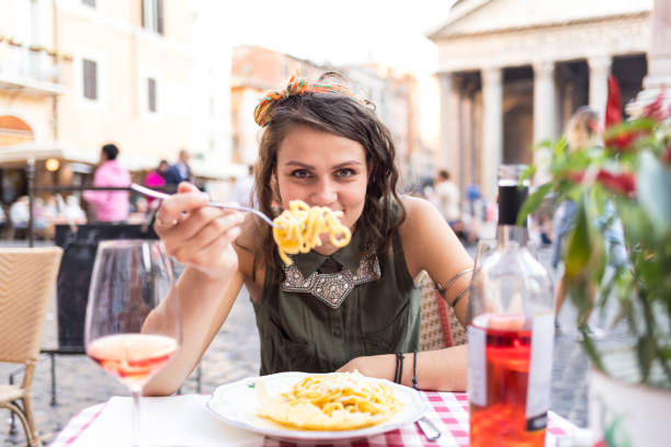 istock Attractive young woman having meal in Rome 949691978