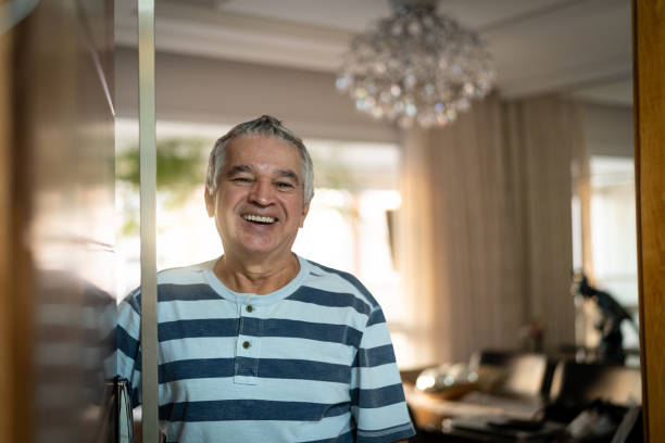 istock Senior Opening His Front Door 949700150