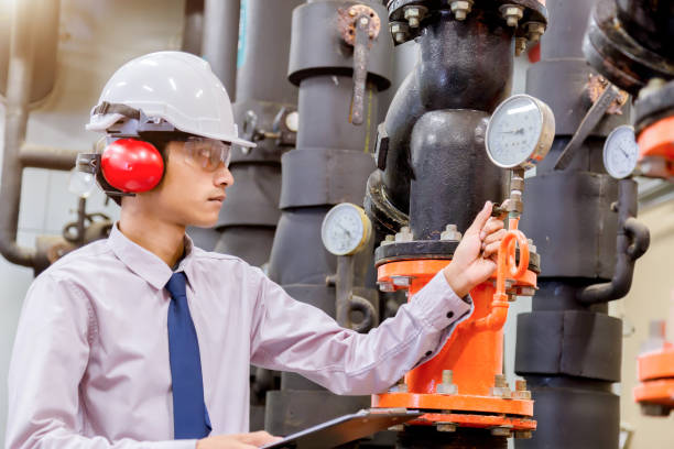 istock Engineer checking Condenser Water pump and pressure gauge , chiller water pump with pressure gauge.System ready. 949711456