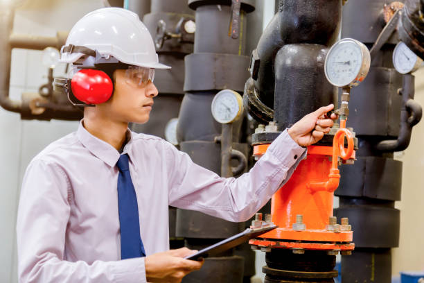 istock Engineer checking Condenser Water pump and pressure gauge , chiller water pump with pressure gauge.System ready. 949711478