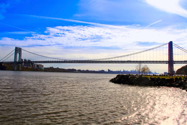 George Washington Bridge A distant view of the historic George Washington Bridge in New York City from north along the Hudson River. gwb stock pictures, royalty-free photos & images