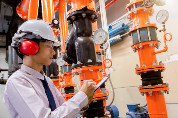 istock Engineer checking Condenser Water pump and pressure gauge , chiller water pump with pressure gauge.System ready. 949714480