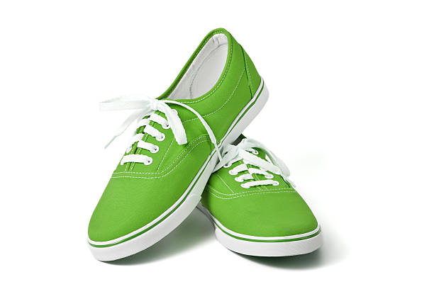 istock New green tennis shoes with white laces 94972003