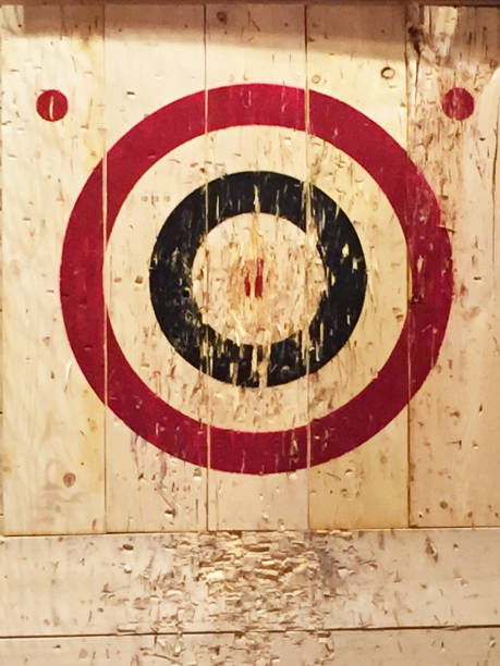 Wooden Targets A red and blue circle make a target on a wooden backdrop. axe throwing stock pictures, royalty-free photos & images