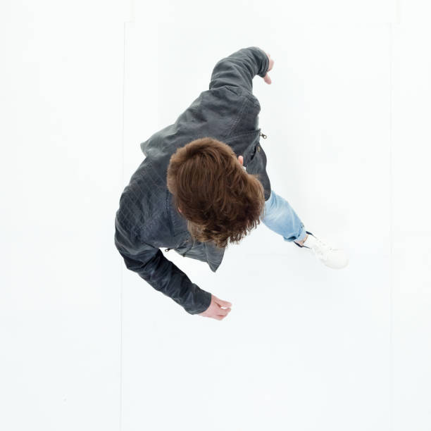 istock Directly above view of young man walking 949736730