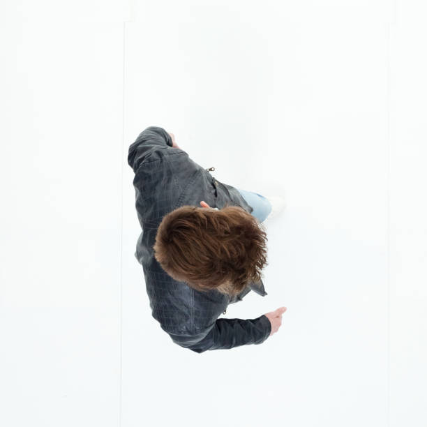 istock Directly above view of young man walking 949736734