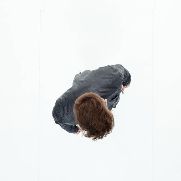 istock Directly above view of young man walking 949736742