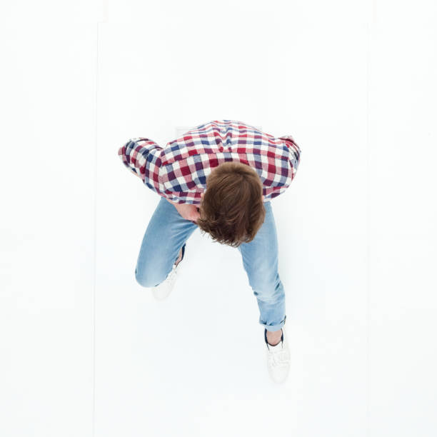 istock Top down view of young man sitting 949736924