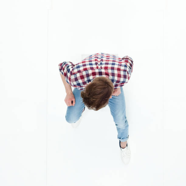 istock Top down view of young man sitting 949736992