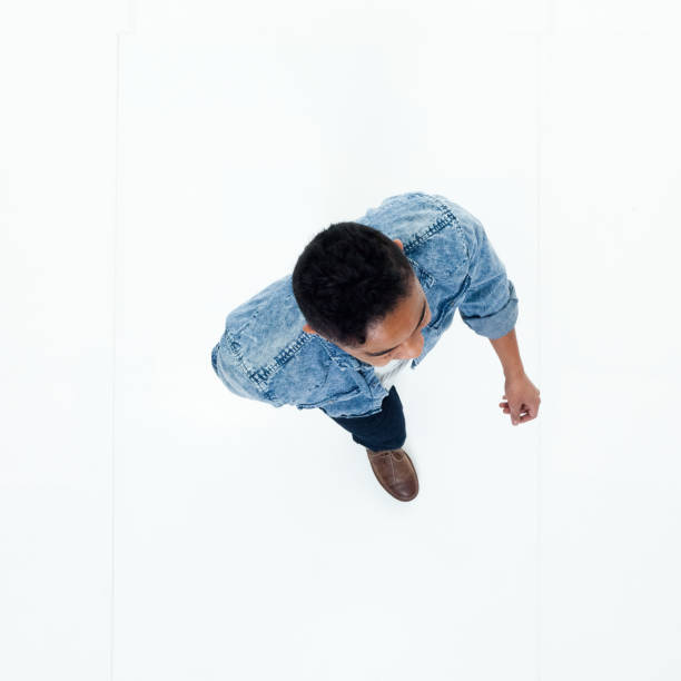 istock Top view of African American man walking 949737098